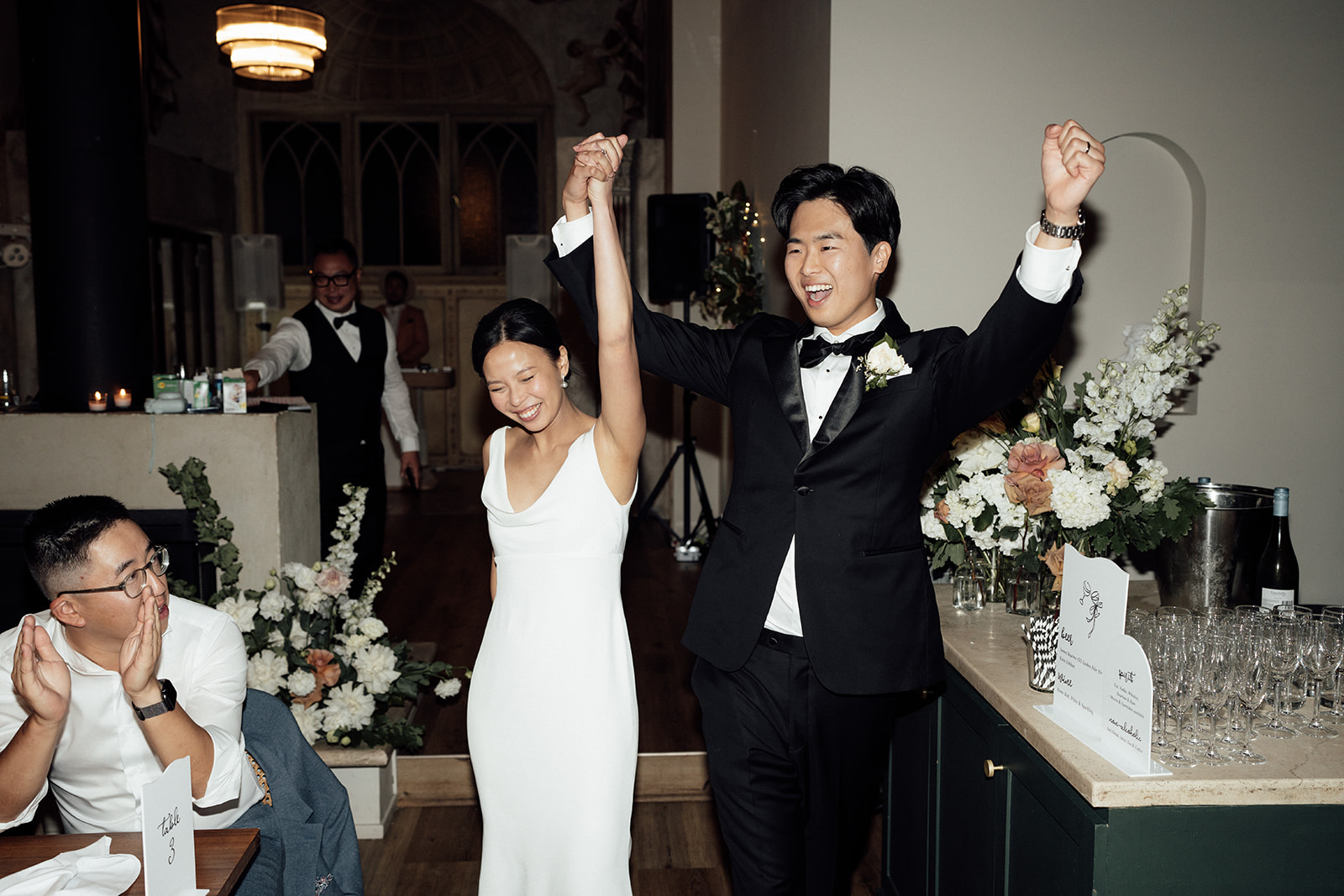 Bride and groom enter their reception at Chapel 1885