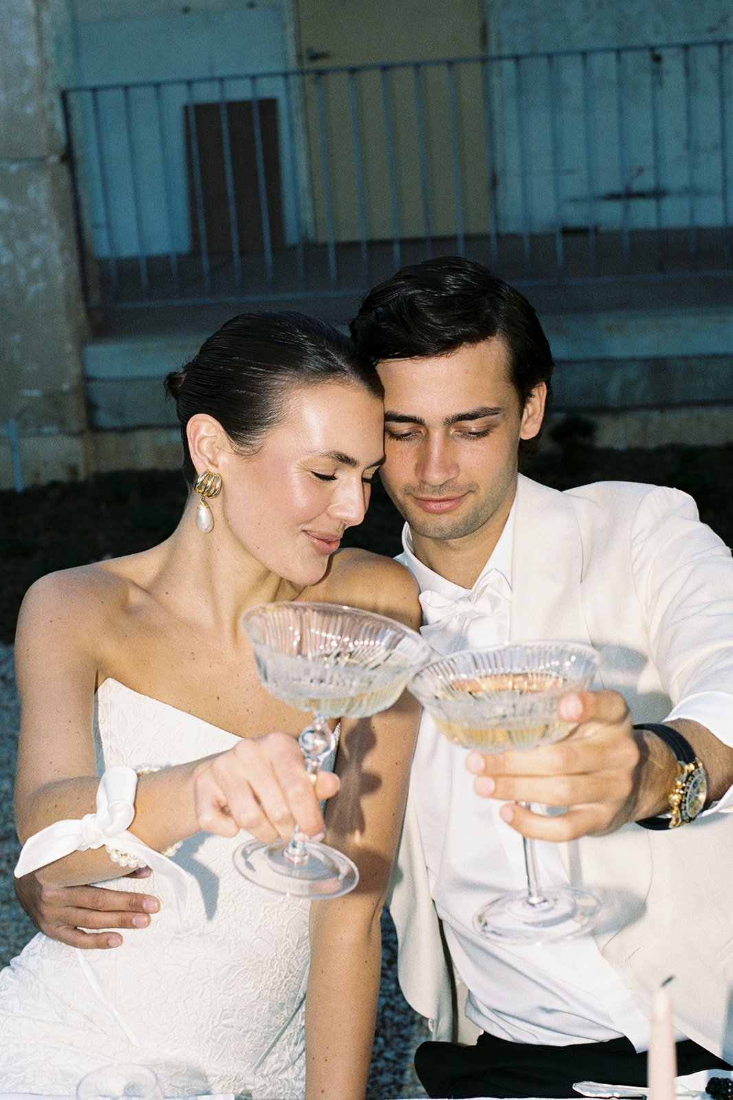 bride and groom enjoy a drink at wedding reception