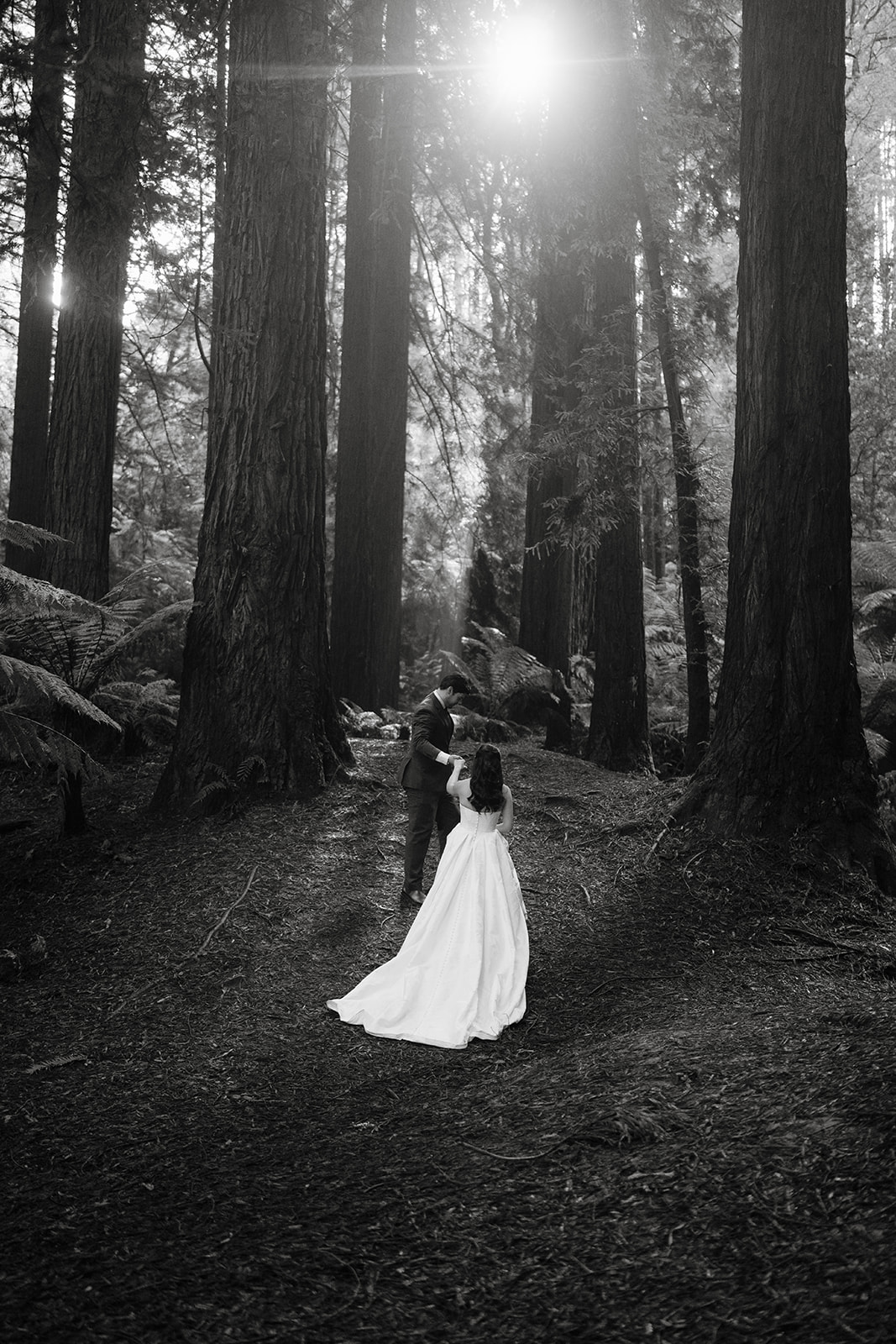Couple walking through the forest in the Otways National park