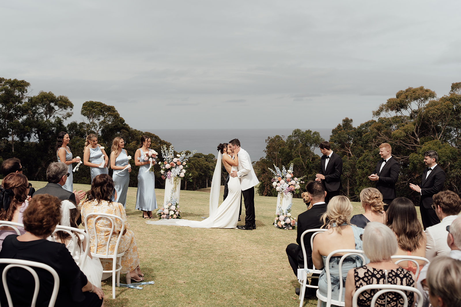 Bride and groom share their first kiss at the Peak Lorne wedding venue