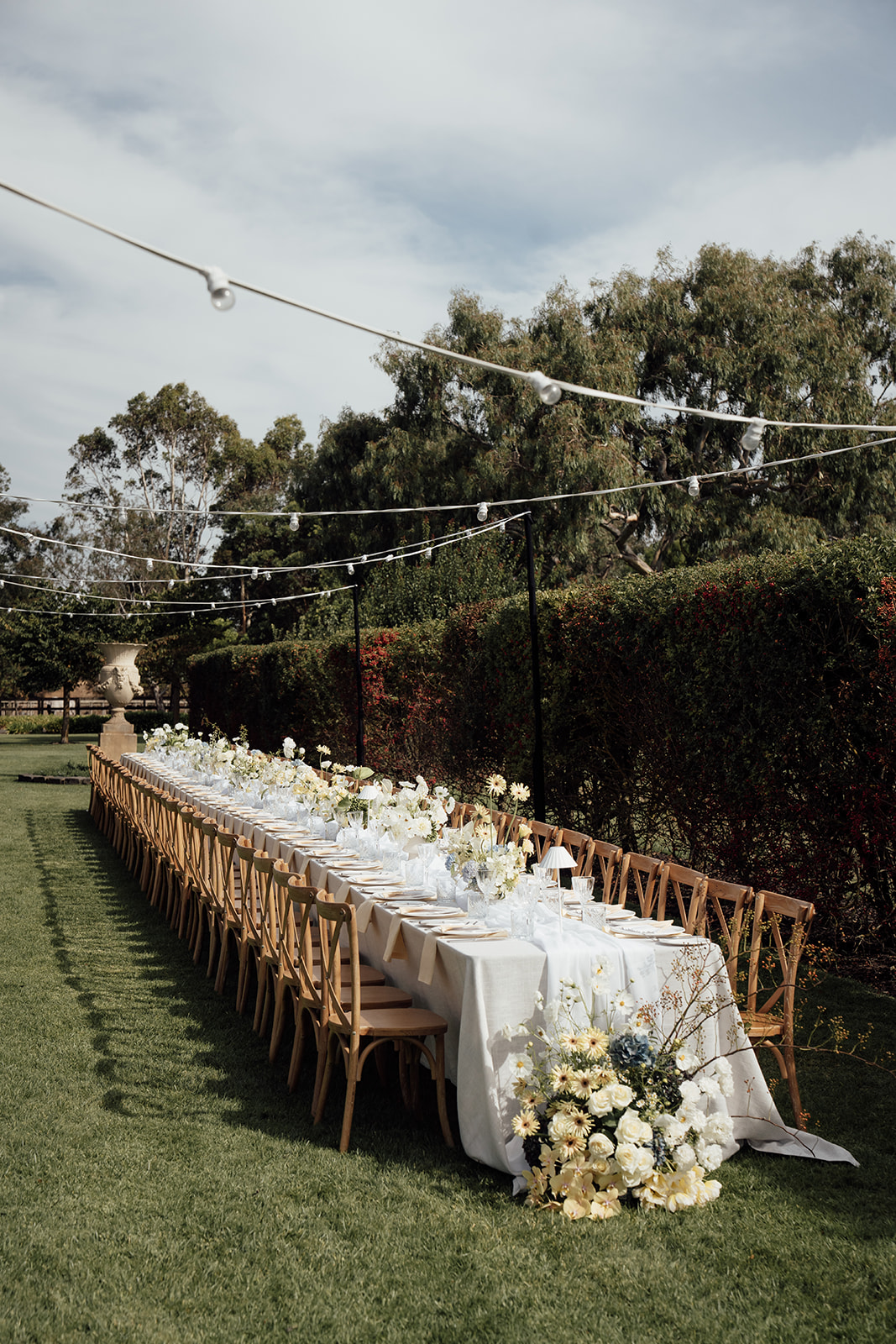Rosemont Homestead reception table under festoon lighting
